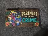 PARROT PARTNERS IN CRIME SIGN