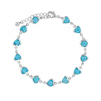 IBRA1385 RHODIUM MULTI LIGHT BLUE HEART BRACELET